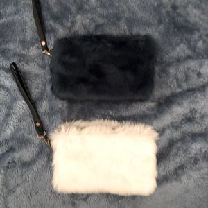 2 8x5 faux fur wristlets. 1 white & 1 blue. Sold as a set.